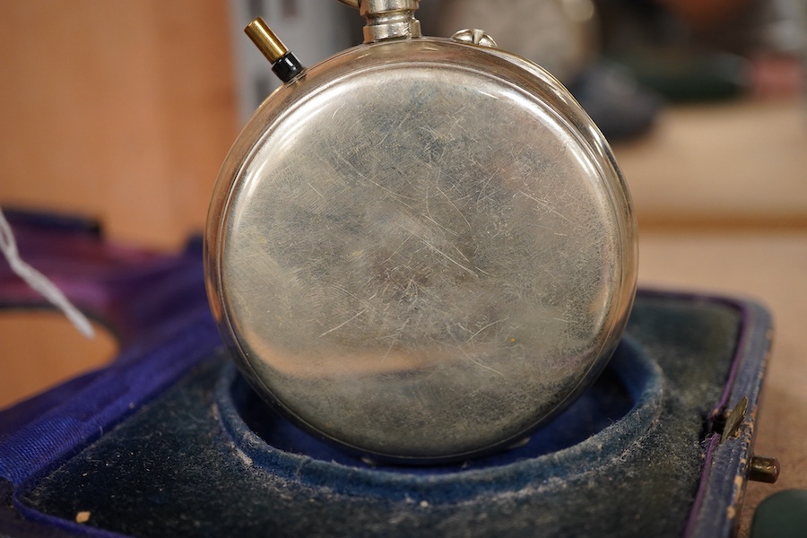 A leather travelling watch case, with nickel case goliath pocket watch, retailed by Asprey, with Roman dial and subsidiary seconds, case diameter 67mm.